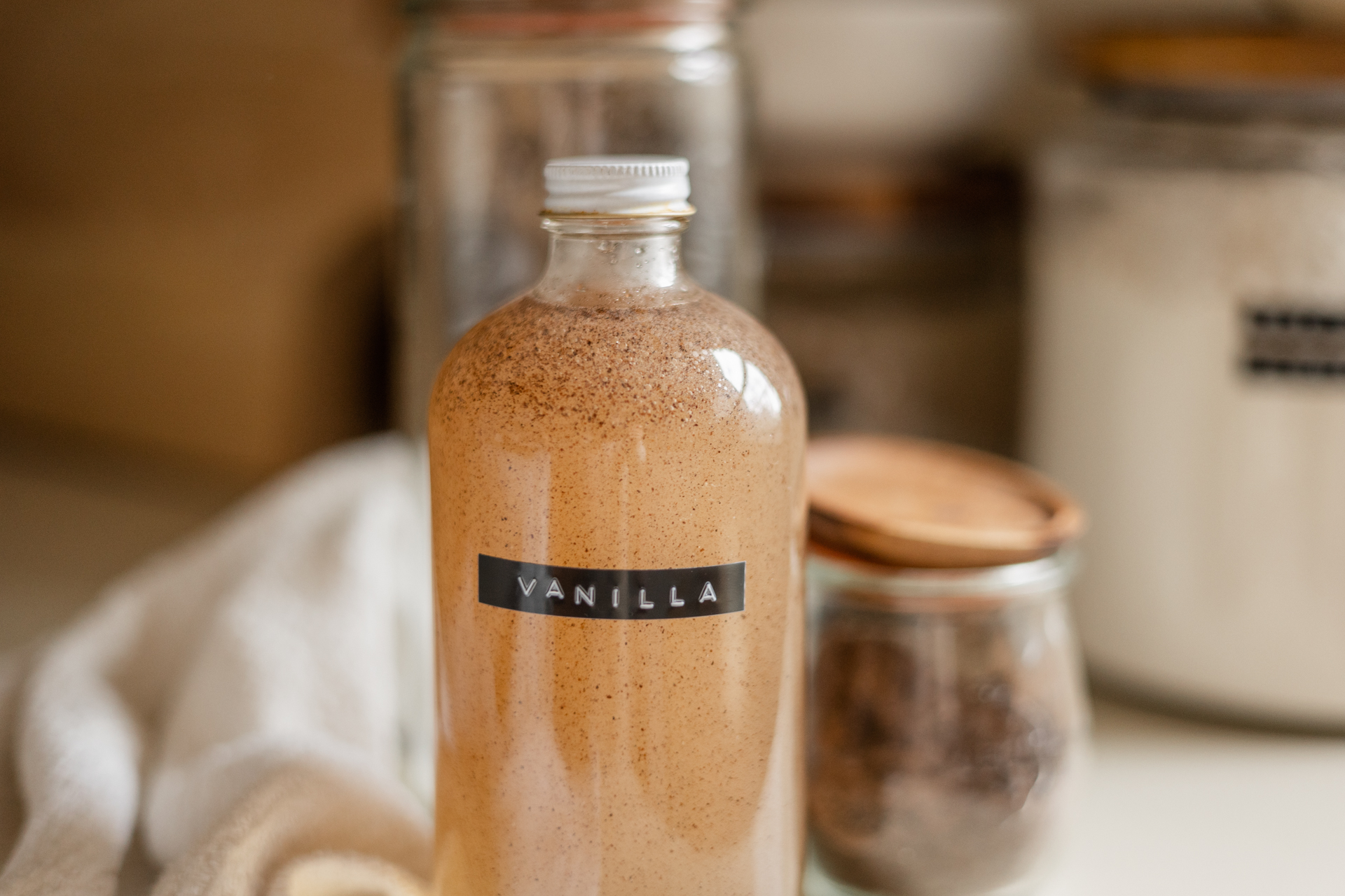 bottle of vanilla bean simple syrup on counter